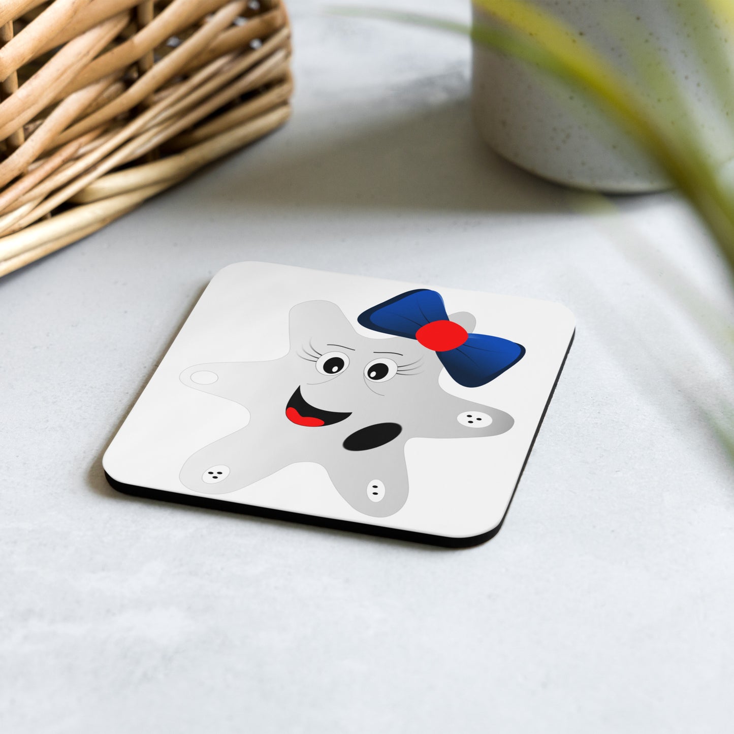 Cartoon image of an amoeba on a cork-backed coaster