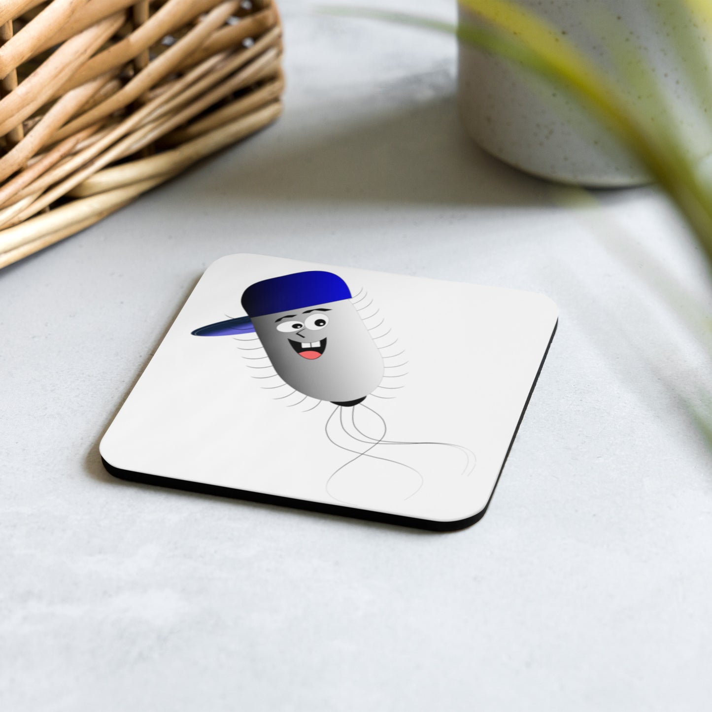 Cartoon image of a bacterium on a cork-backed coaster
