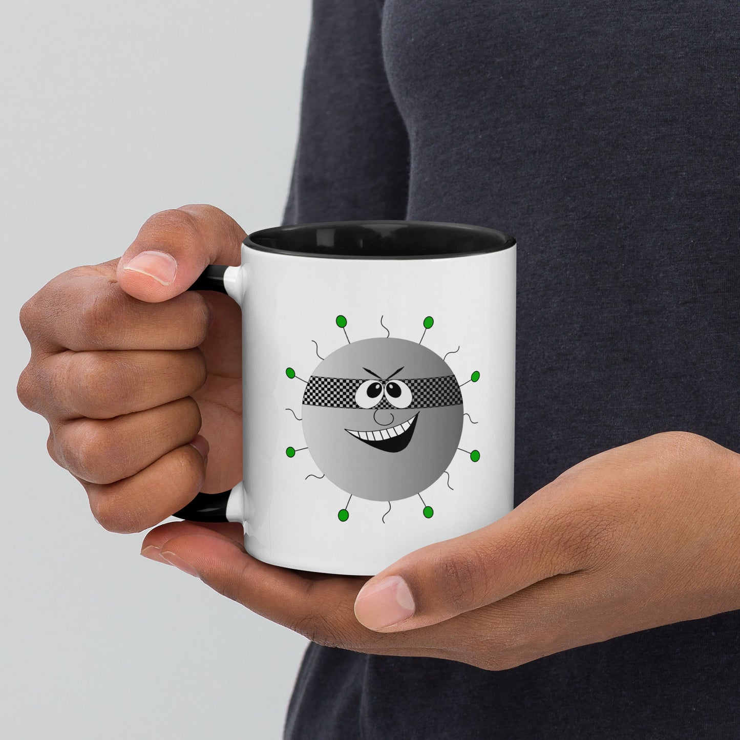 Mug featuring a whimsical cartoon image of a virus and a burst of color inside.