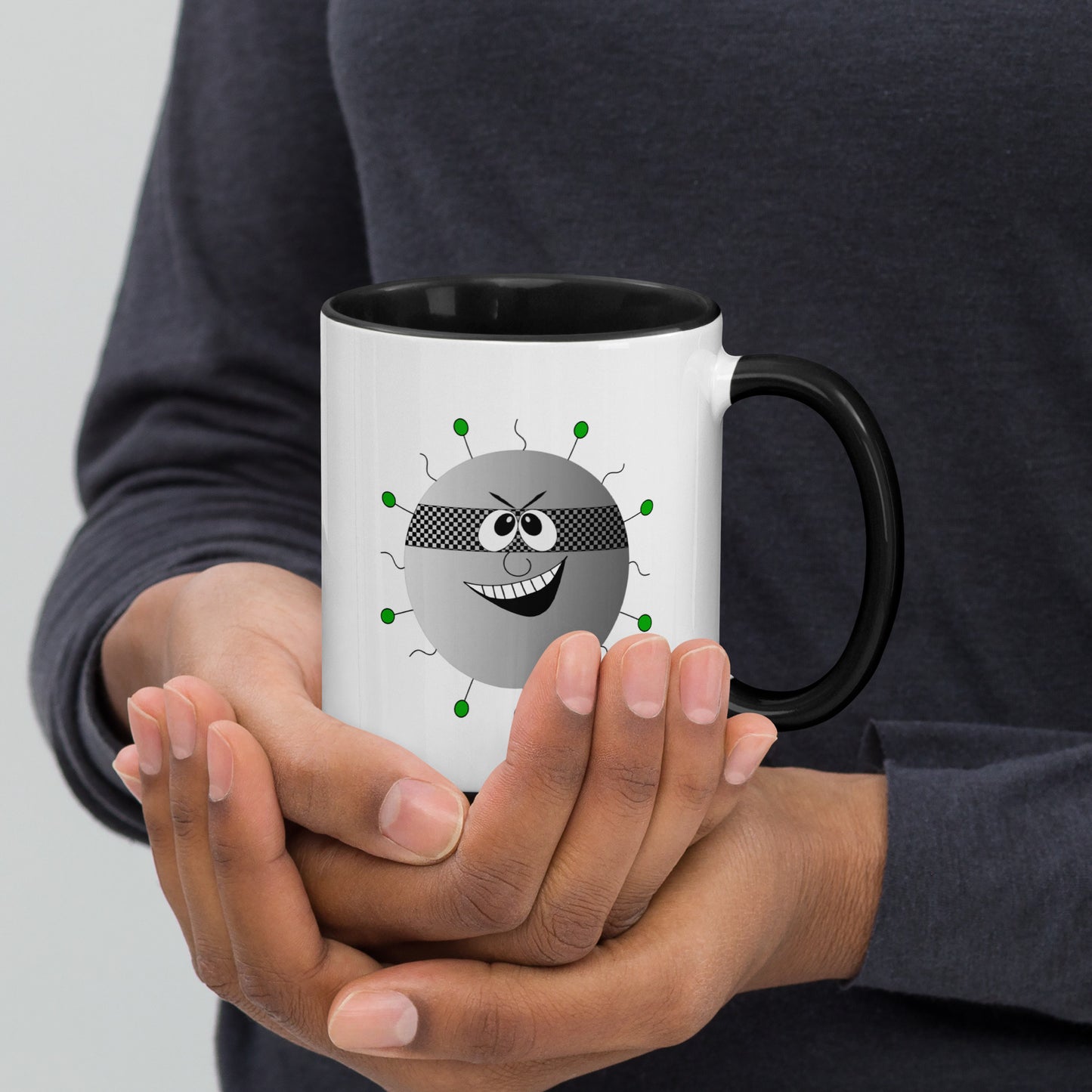 Mug featuring a whimsical cartoon image of a virus and a burst of color inside.