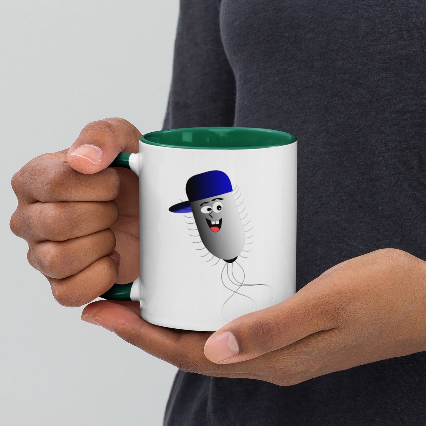 Mug featuring a whimsical cartoon image of a bacteria and a burst of color inside.