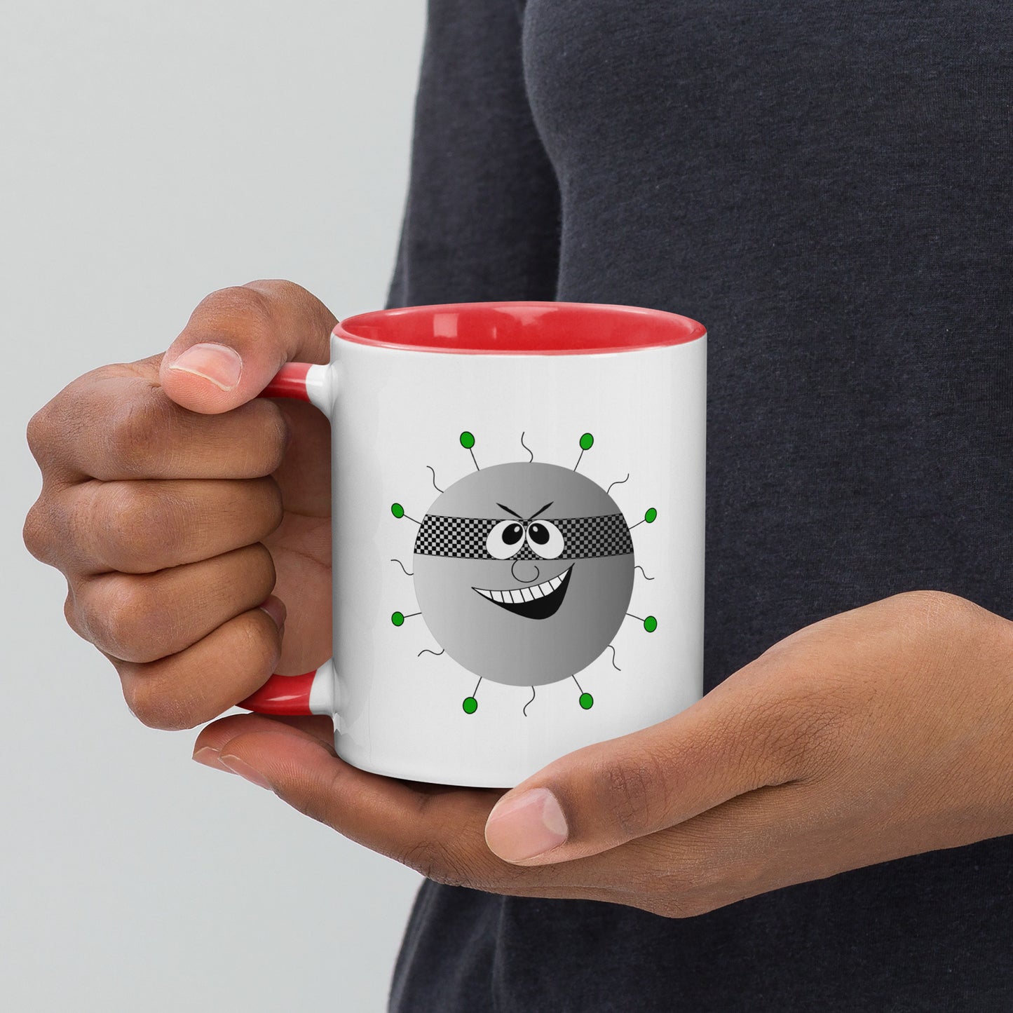 Mug featuring a whimsical cartoon image of a virus and a burst of color inside.