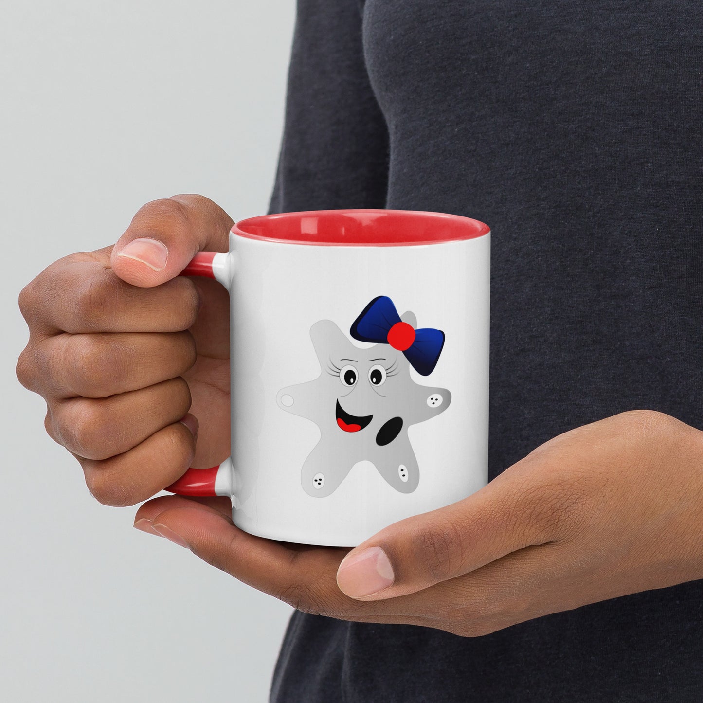 Mug featuring a whimsical cartoon image of an amoeba and a burst of color inside.