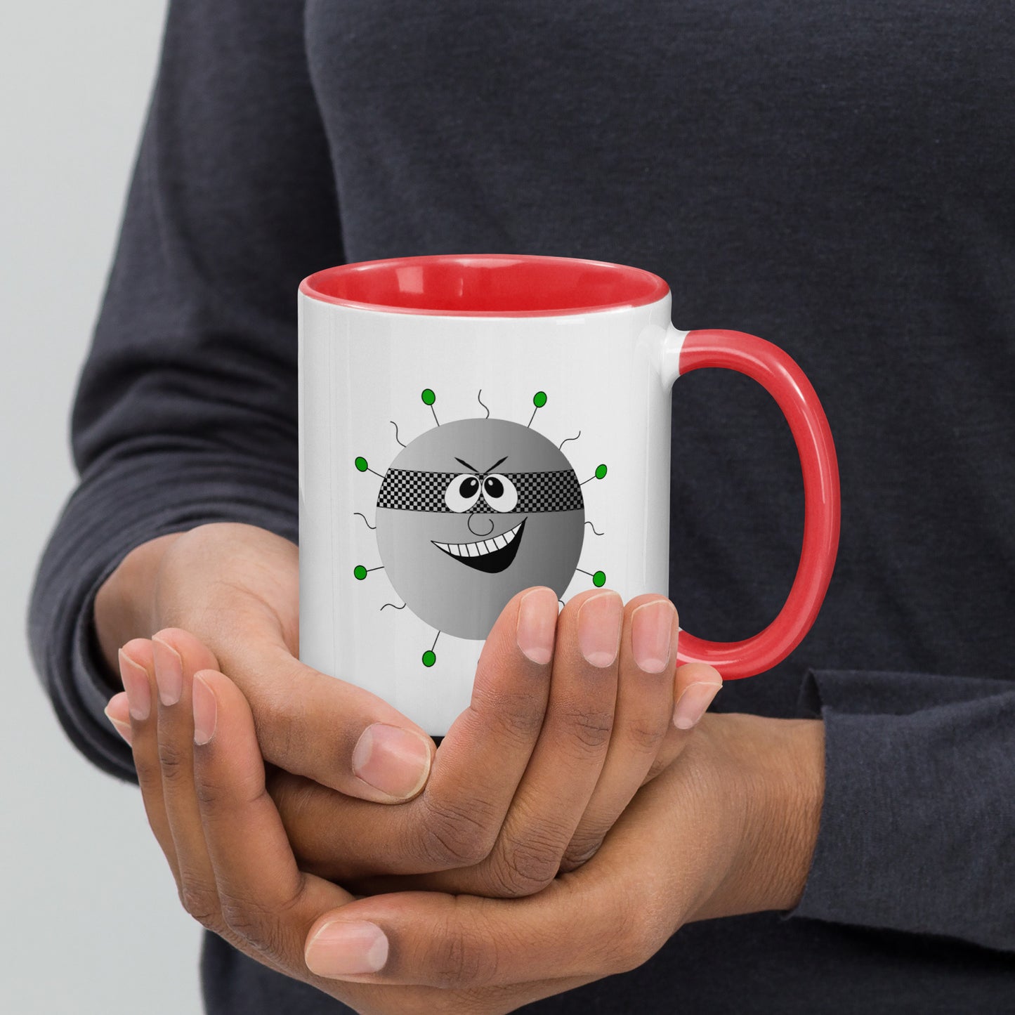 Mug featuring a whimsical cartoon image of a virus and a burst of color inside.