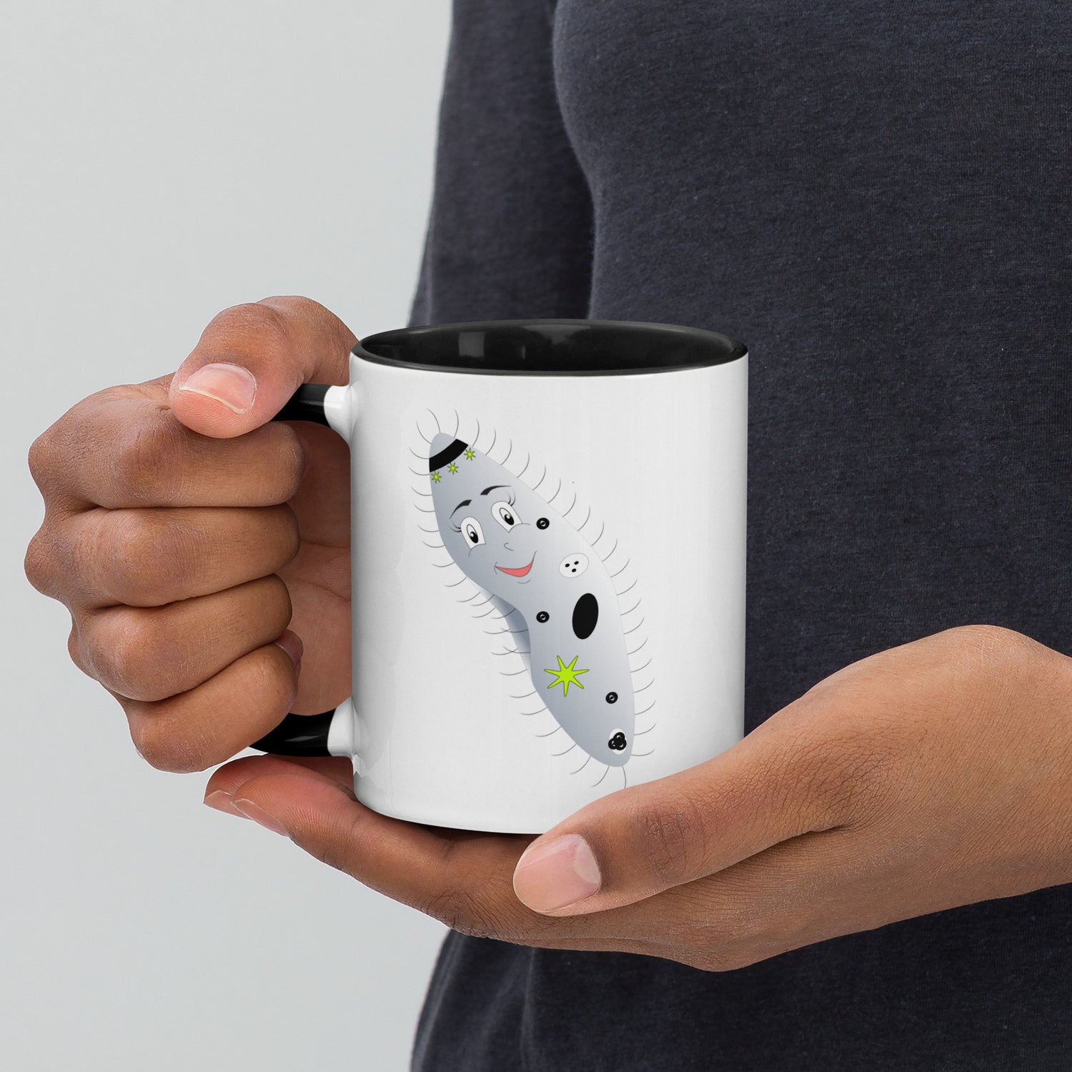 Mug featuring a whimsical cartoon image of an paramecium and a burst of color inside. 