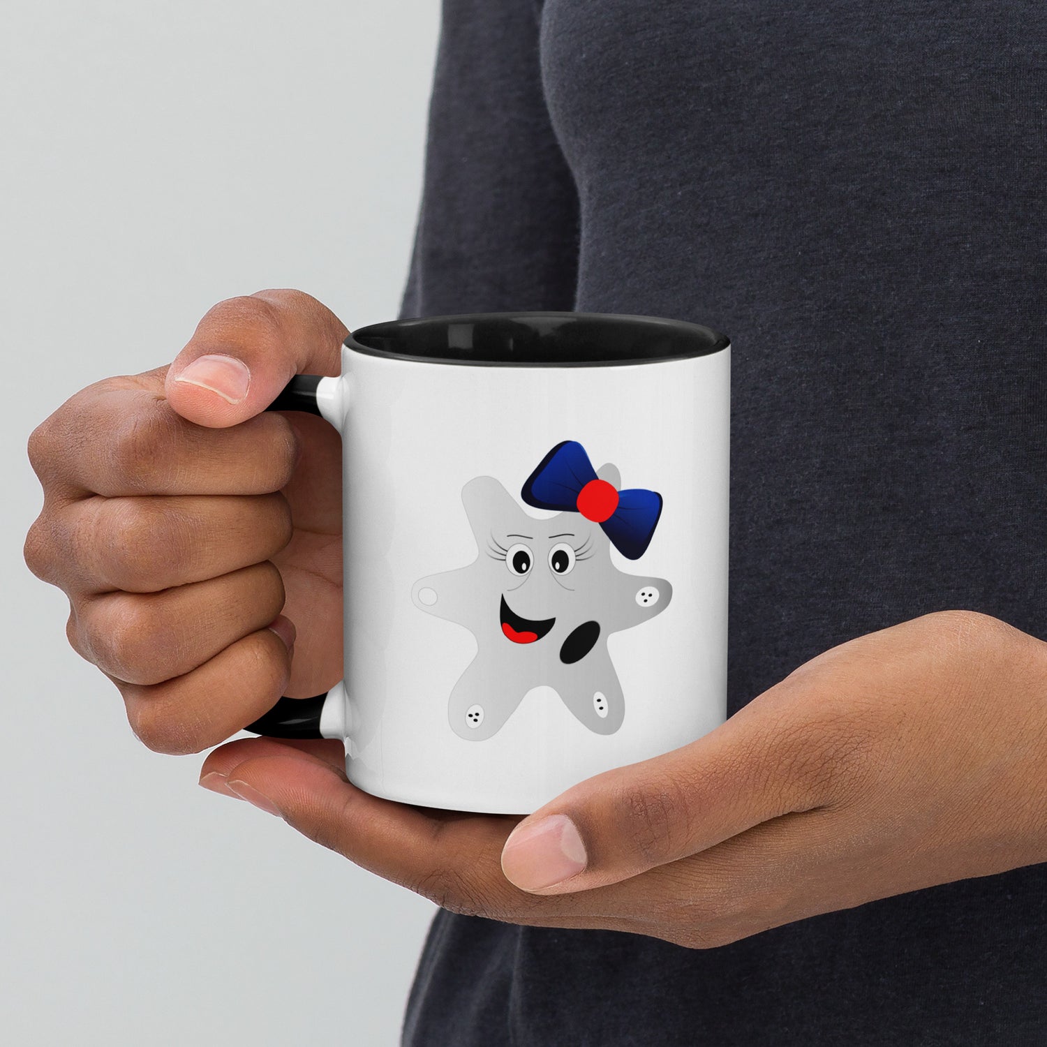 Mug featuring a whimsical cartoon image of an amoeba and a burst of color inside. 